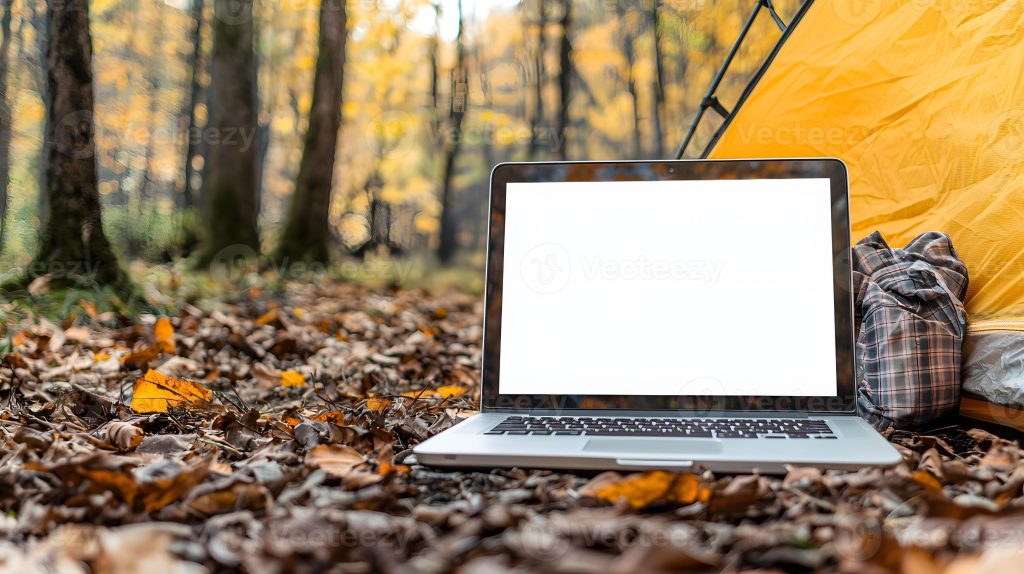 alt="Digital nomad working under a solar canopy in a forest"